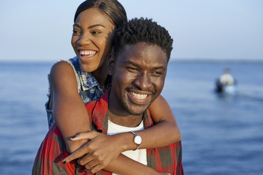 Romantic couple standing at the sea, portrait